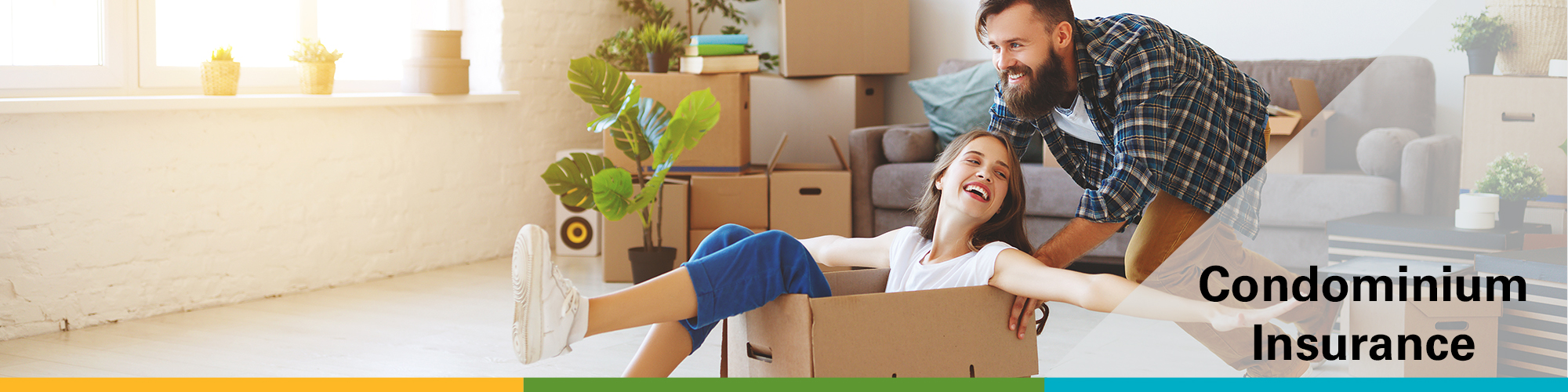 a couple unpacking into an empty living room