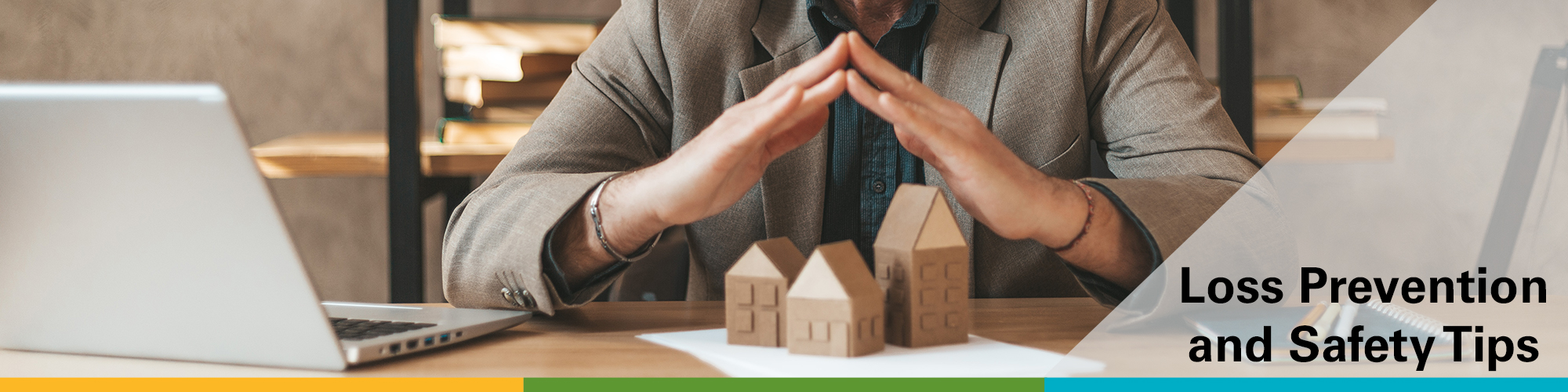 two hands forming a steeple over clay homes